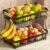 2 Tier Fruit Basket for Kitchen Counter with 2 Mobile Banana Hangers, 2025 Pro Detachable Metal Fruit Bowl with Wooden Handle, Fruit Holder for Bread Snack Veggies with Protective Mats
